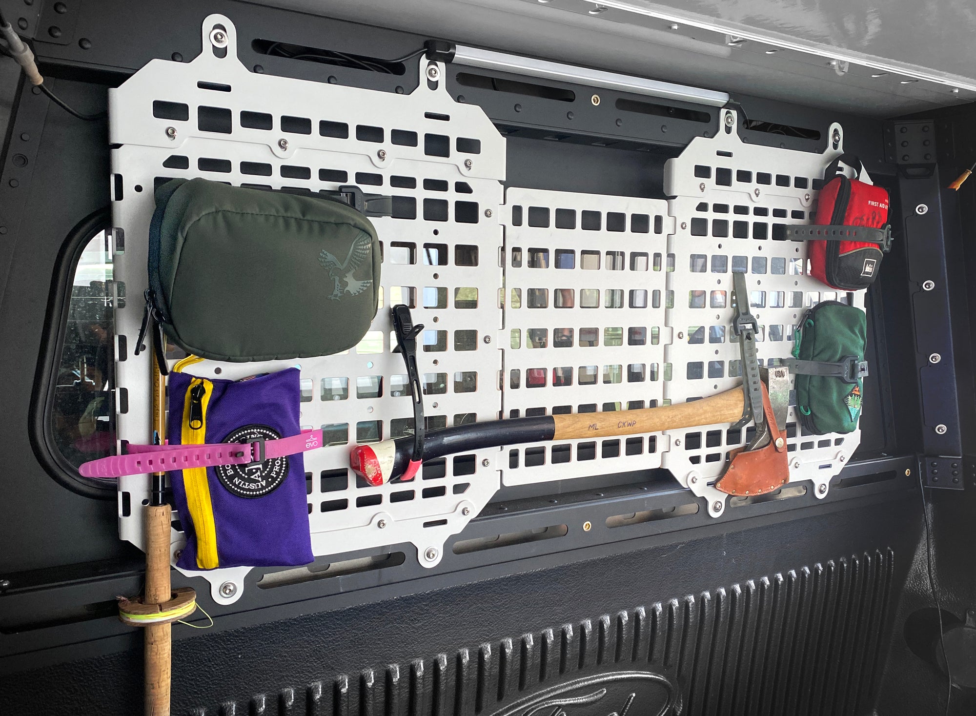 Vertical molle storage panels inside the X1 Camper